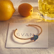 Load image into Gallery viewer, Pave Blue Hamsa Hand Beaded Bangle on top of a SVANA Design card
