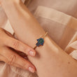 Load image into Gallery viewer, A model wearing Pave Blue Hamsa Hand Beaded Bangle
