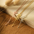 Load image into Gallery viewer, Personalized Birth Flower Necklaces on the edge of an open book
