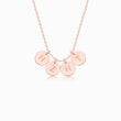 Load image into Gallery viewer, 4 rose gold disc pendants with engraved initial on rose gold necklace on white background
