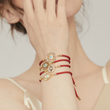 Load image into Gallery viewer, A model wearing Round Multicolored Charm Evil Eye Red String and other Evil Eye bracelets
