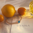 Load image into Gallery viewer, Round Shaped Blue Evil Eye Beaded Bangle with oranges in the back
