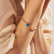 Load image into Gallery viewer, A model wearing Round Shaped Blue Evil Eye Beaded Bangle
