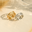 Load image into Gallery viewer, Top view of Personalized Roman Numerals Memorial Rings placed on a creamy white fabric
