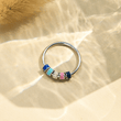 Load image into Gallery viewer, Enamel Anxiety Fidget Ring positioned on the top of the fabric
