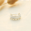 Load image into Gallery viewer, Silver plated memorial plume ring placed on top of a piece of paper
