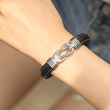 Load image into Gallery viewer, A close-up shot of a model wearing Mother and Daughter Forever Linked Together Braided Leather Bracelet
