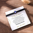 Load image into Gallery viewer, To My Grandson Evil Eye Braided Bracelet wrapped around a note
