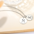 Load image into Gallery viewer, To My Mom Personalized Disc Silver Necklace displayed on the top of an empty book page
