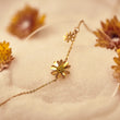 Load image into Gallery viewer, Sunflower Gold Ankle Bracelet placed on top of brown cloth
