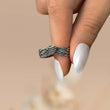 Load image into Gallery viewer, silver Until We Meet Again Personalized Angel Wing Ring held between a model&#39;s fingers
