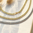 Load image into Gallery viewer, gold and silver Link Chain Necklaces on an open book
