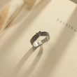 Load image into Gallery viewer, silver Until We Meet Again Personalized Angel Wing Ring on a page of an open book
