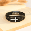 Load image into Gallery viewer, To My Son, Pray Wait &amp; Trust Leather Cross Bracelet on top of an open book
