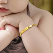 Load image into Gallery viewer, baby model wearing gold Personalized Baby Name Bracelet
