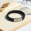 Load image into Gallery viewer, Personalized Leather Bracelet on open page of a book
