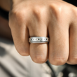 Load image into Gallery viewer, To My Grandson Evil Eye Fidget Ring worn on the ring finger by a model with a closed fist
