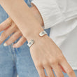Load image into Gallery viewer, To My Bonus Daughter, I&#39;m So Proud of You Bracelet worn by a model on her right wrist
