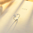 Load image into Gallery viewer, The Love Between a Grandmother and Granddaughter is Forever Ring placed  on the top of a book
