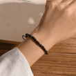 Load image into Gallery viewer, Morse code bracelet with hidden message &quot;I am so proud of you&quot; bracelet worn by a female model
