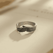 Load image into Gallery viewer, My Mom Is My Guardian Angel Personalized Wing Ring on a page of an open book

