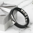 Load image into Gallery viewer, To My Bonus Son Leather Bracelet leaning on a gift box
