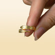 Load image into Gallery viewer, gold Dad, You Walk Beside Me Everyday Plume Ring held between a models fingers
