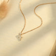 Load image into Gallery viewer, Sagittarius zodiac sign necklace placed on top of a brown paper
