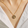 Load image into Gallery viewer, A model wearing Round LOVE Evil Eye Gold Tone Necklace
