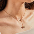 Load image into Gallery viewer, White Butterfly Necklace Long Chain gold plated Pendant being worn by a model
