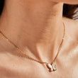 Load image into Gallery viewer, Pearl Butterfly Necklace Gold plated Chain worn by a model
