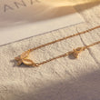 Load image into Gallery viewer, Butterfly Necklace Gold Chain Lock placed on top a white fabric

