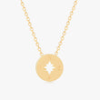 Load image into Gallery viewer, Gold compass necklace in a white background
